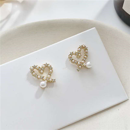 Irregular Hollow Heart Pearl Earrings
